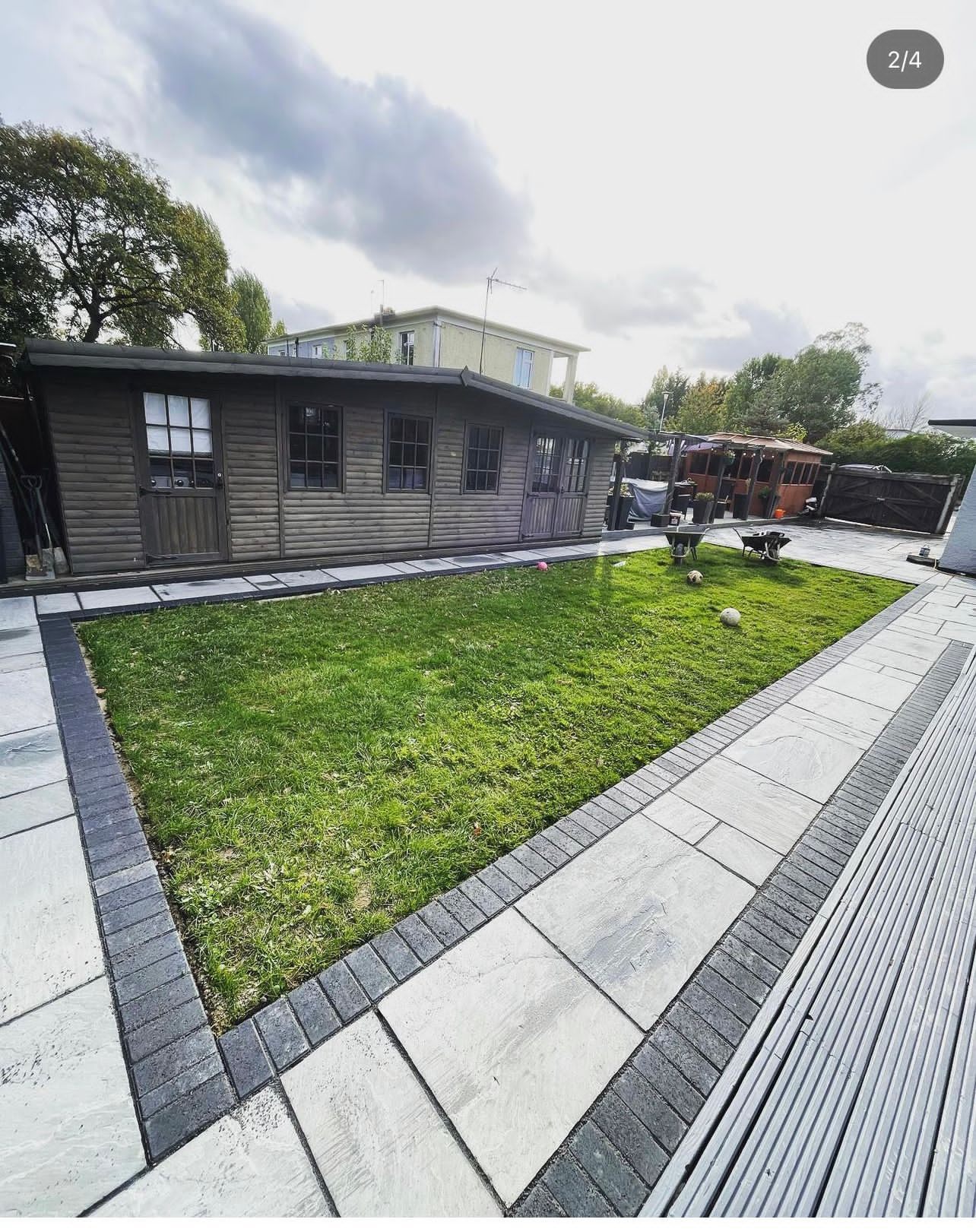 Garden landscaping with lawn and paved border