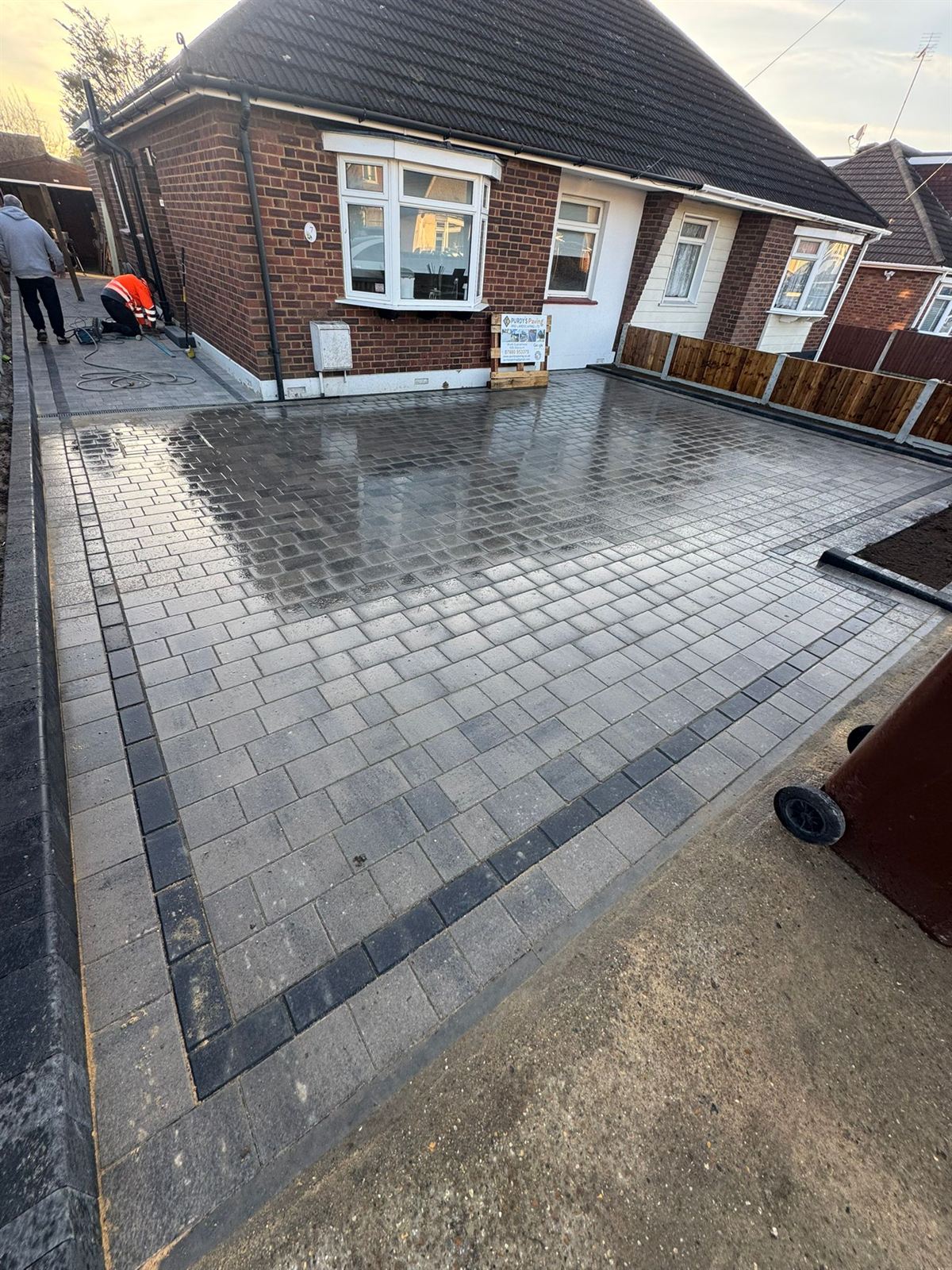 Newly laid block paving driveway with crisp contrast border